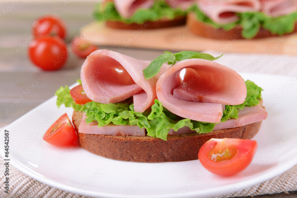Delicious sandwich with lettuce and ham Delicious sandwich with lettuce and ham