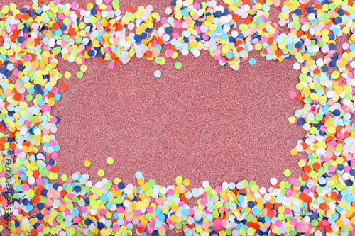 Confetti on shiny pink background