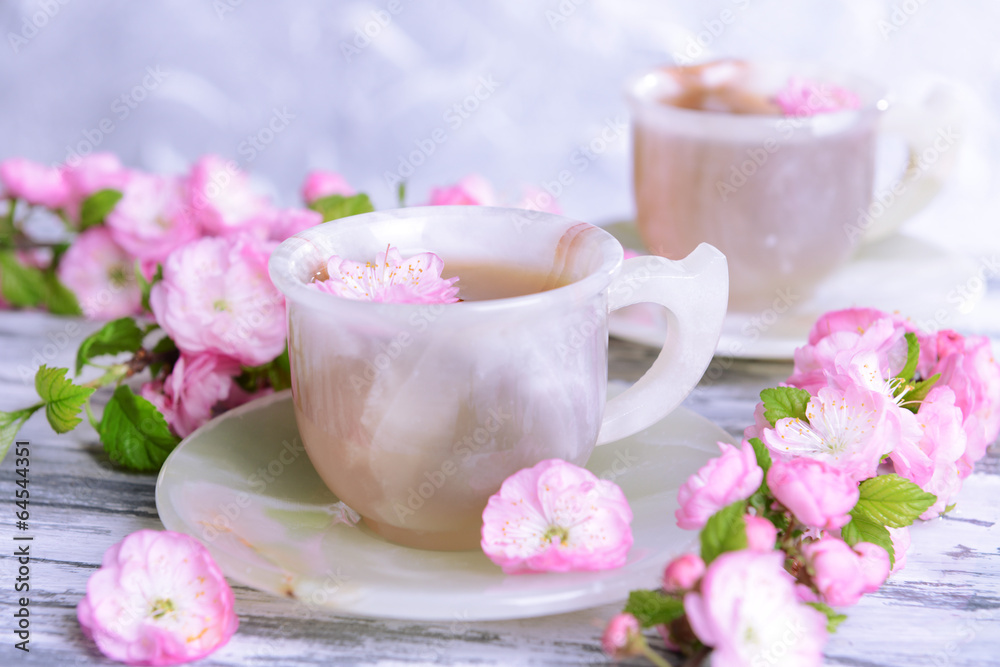 Beautiful fruit blossom with cup of tea Beautiful fruit blossom with cup of tea