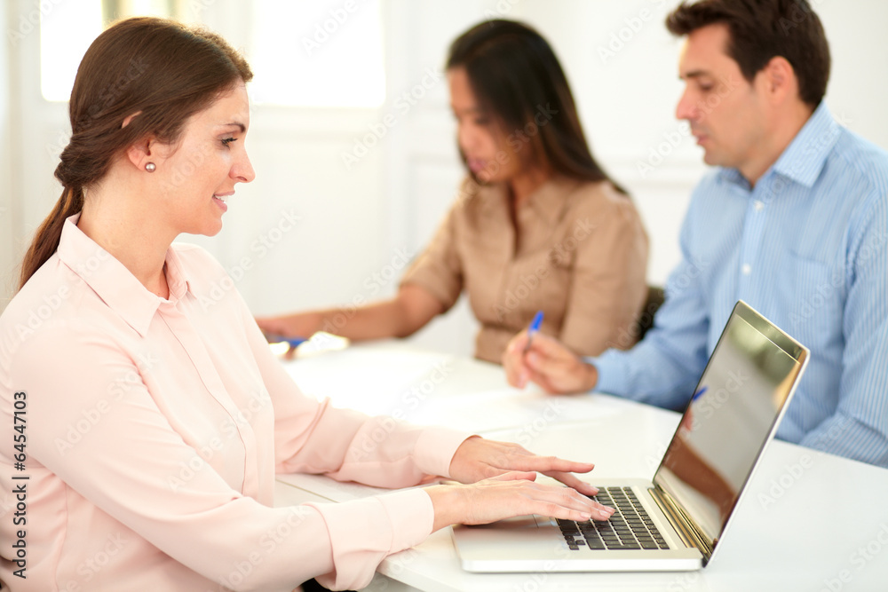 Caucasian businesswoman working on her laptop Caucasian businesswoman working on her laptop