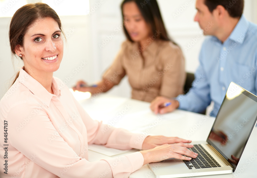Professional executive woman smiling at you Professional executive woman smiling at you