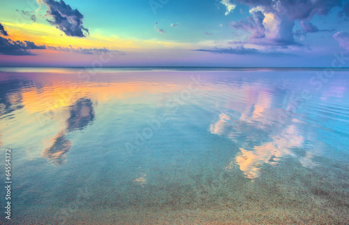 Magic colorful sunset over sea photo