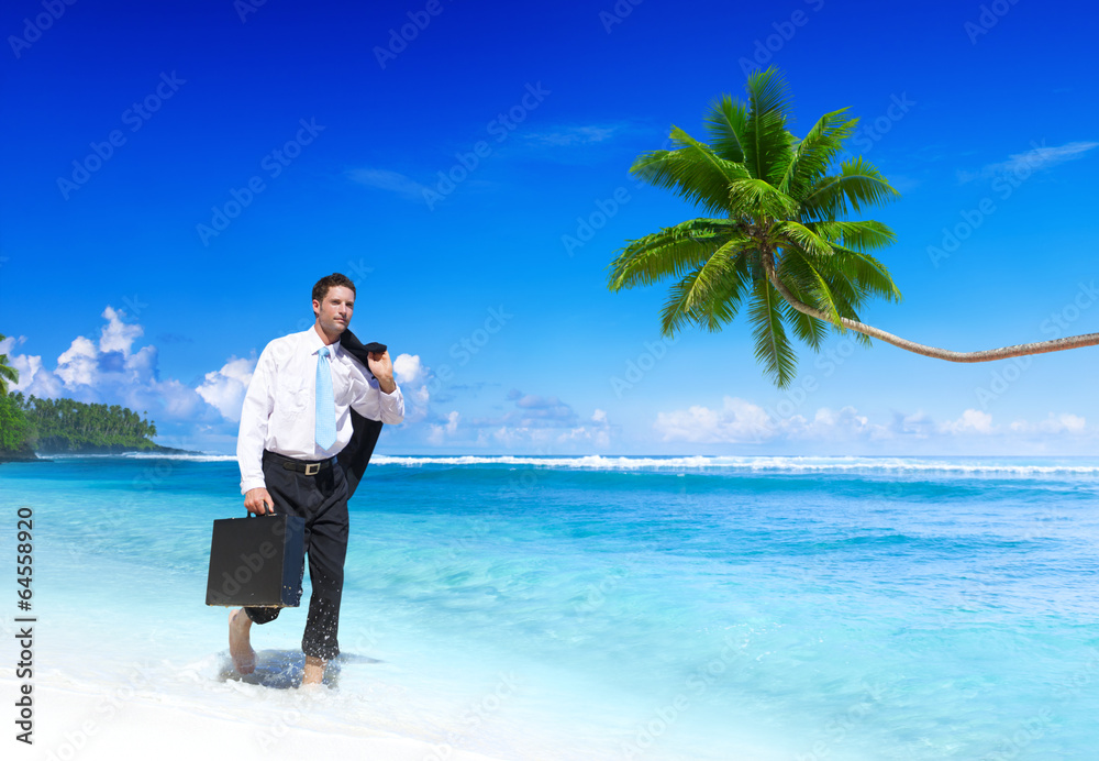 Businessman Walking along the Tropical Beach Businessman Walking along the Tropical Beach