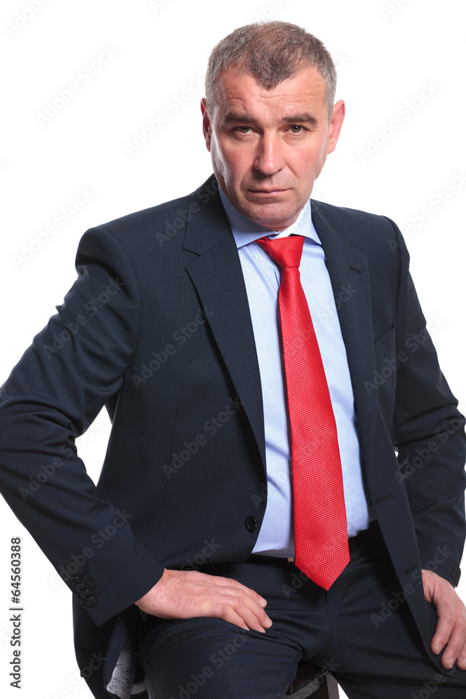 serious business man sitting on chair serious business man sitting on chair