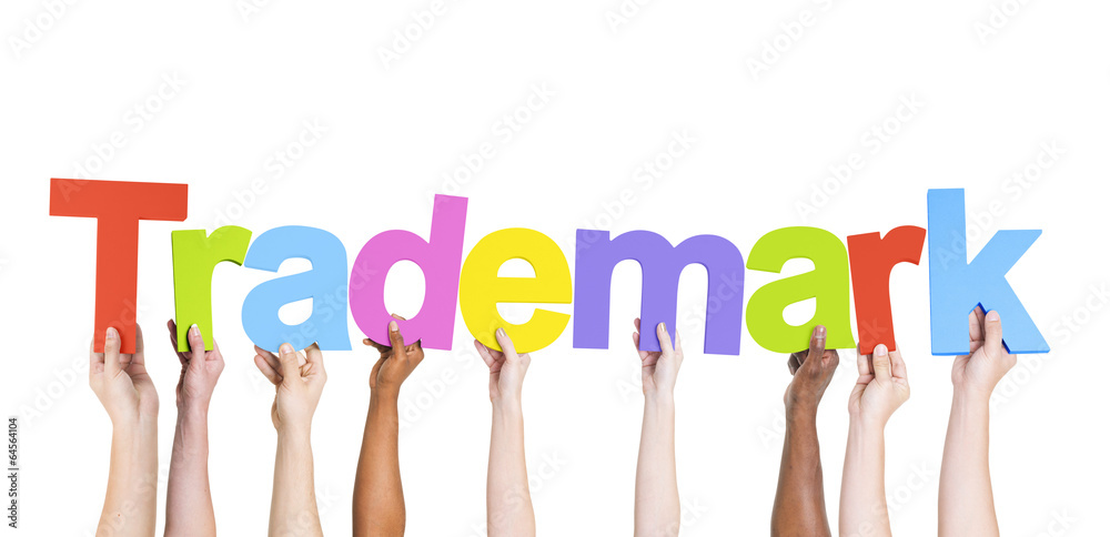 Multiethnic Group of Hands Holding Trademark