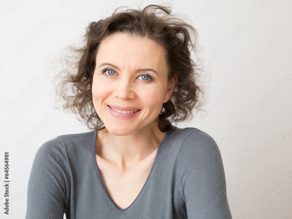 Romantic woman looking into camera with smile Romantic woman looking into camera with smile