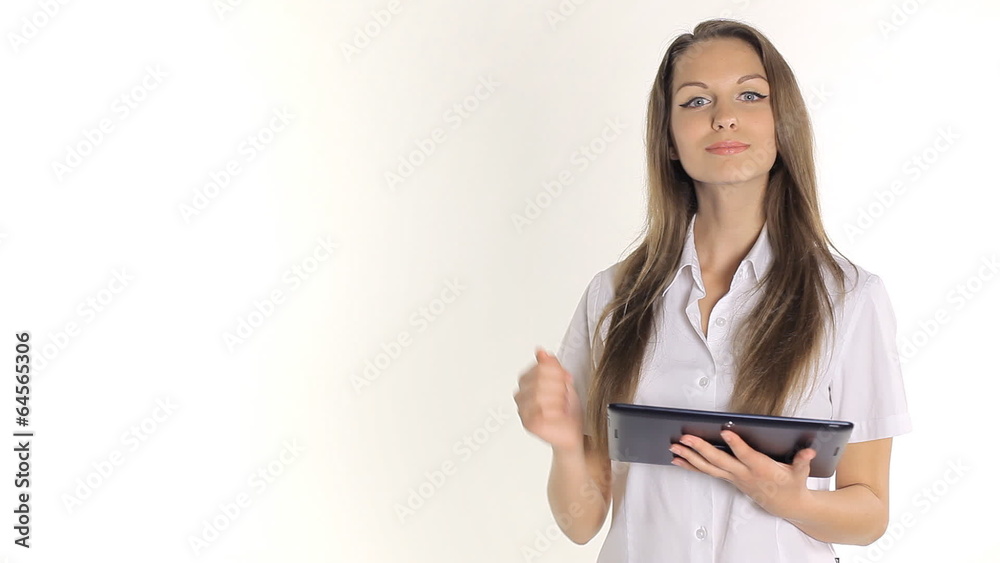 Beautiful girl shows information from the tablet on a white Beautiful girl shows information from the tablet on a white