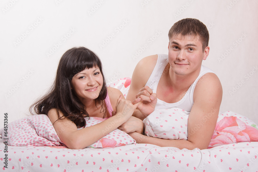 Lovers put up in bed after an argument