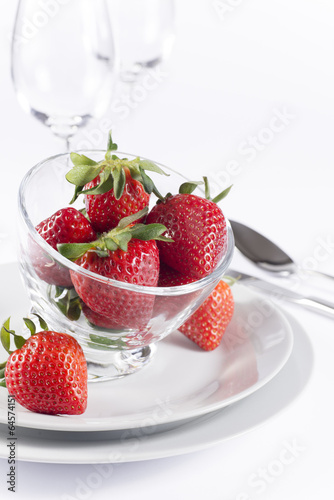 Festive table set with strawberry on white background