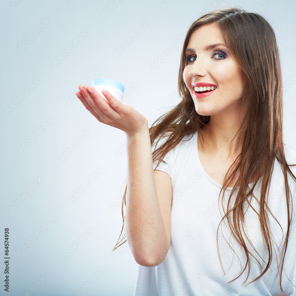 Young woman hold skin care cosmetic. Clean skin. Beauty female Young woman hold skin care cosmetic. Clean skin. Beauty female
