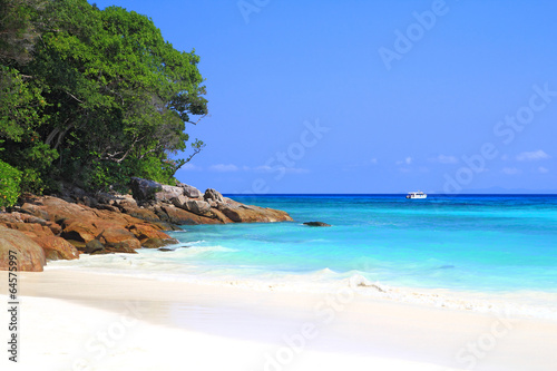 Blue sea and white sandy beach