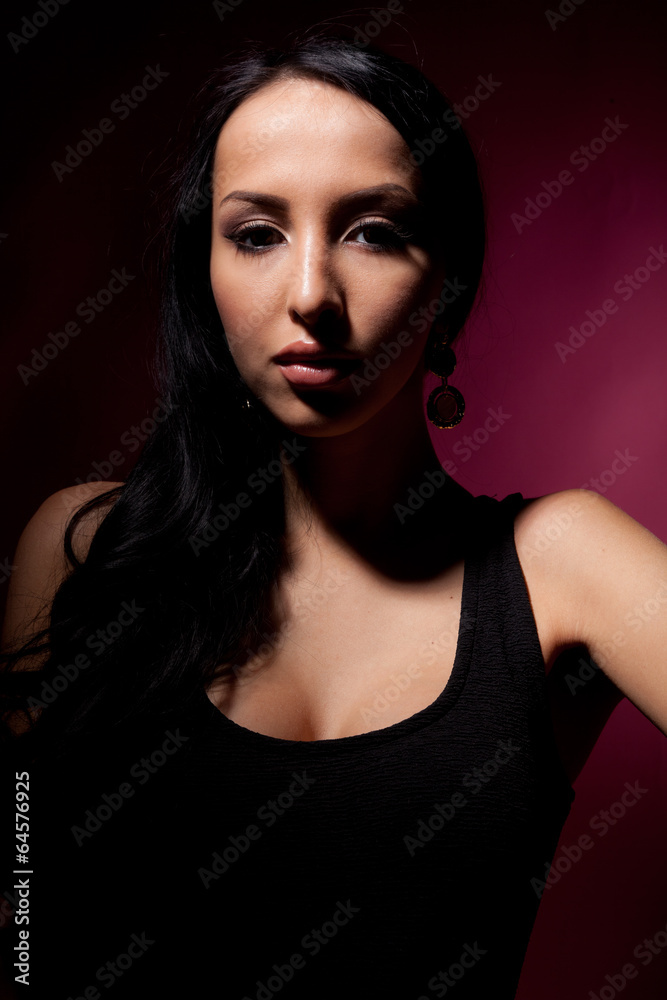 portrait of a beautiful girl on a red background.