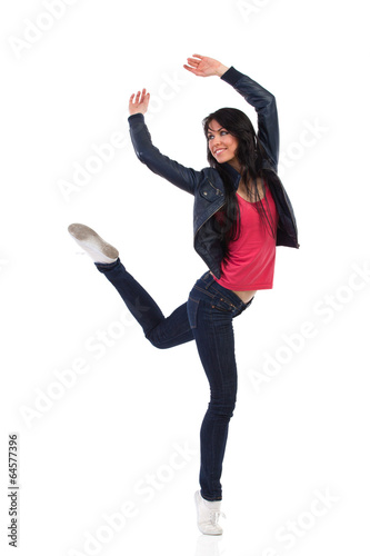Casual woman dancing on one leg