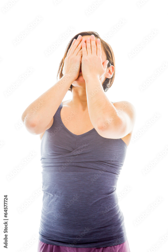 Young woman hiding face with hands Young woman hiding face with hands