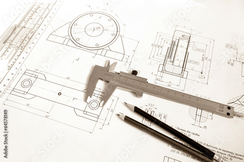 Drawing of the bearing housing with vernier calipers and pencils photo