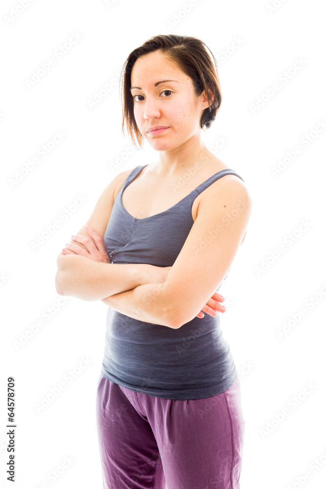 Young woman standing with her arms crossed Young woman standing with her arms crossed