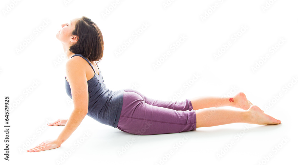 Young woman practicing yoga in cobra pose Young woman practicing yoga in cobra pose
