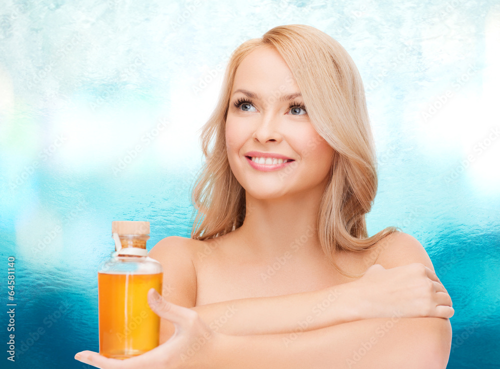 happy woman with oil bottle happy woman with oil bottle