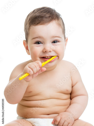 baby cleaning teeth and smiling, isolated on white background