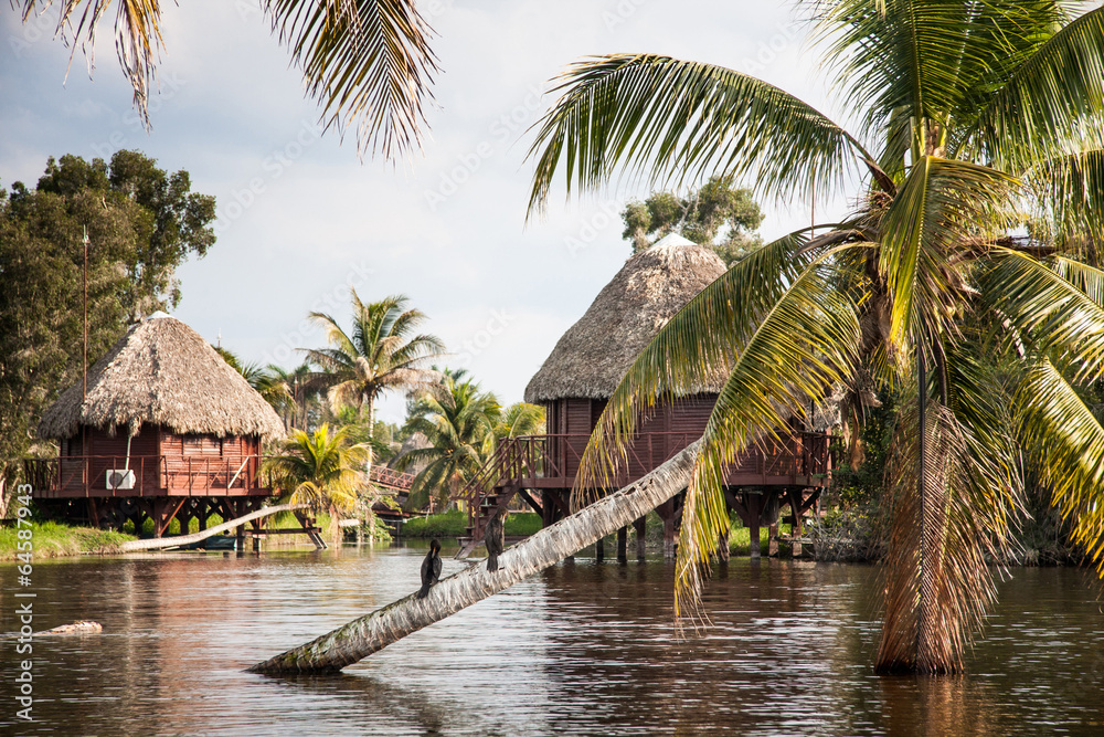 Houses over pillars at a Black lake in the cuban tourist village