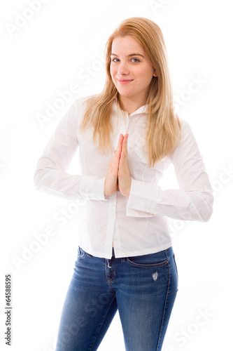 Young woman standing in prayer position