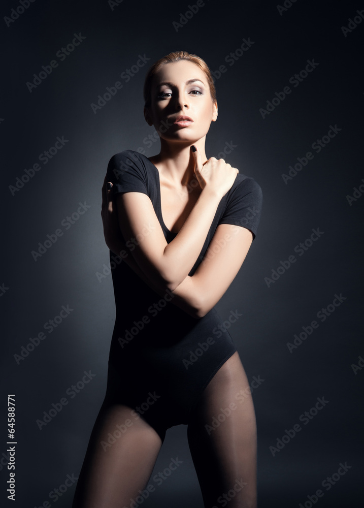Young, beautiful and fit fashion model posing in studio Young, beautiful and fit fashion model posing in studio