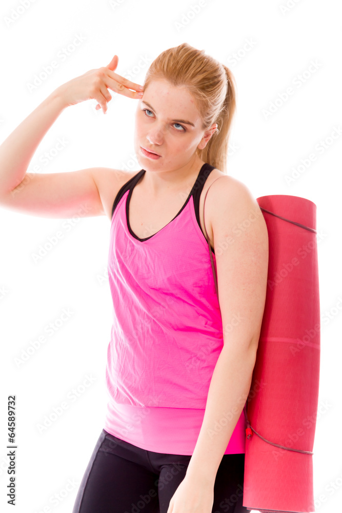 Young woman carrying exercising mat thinking