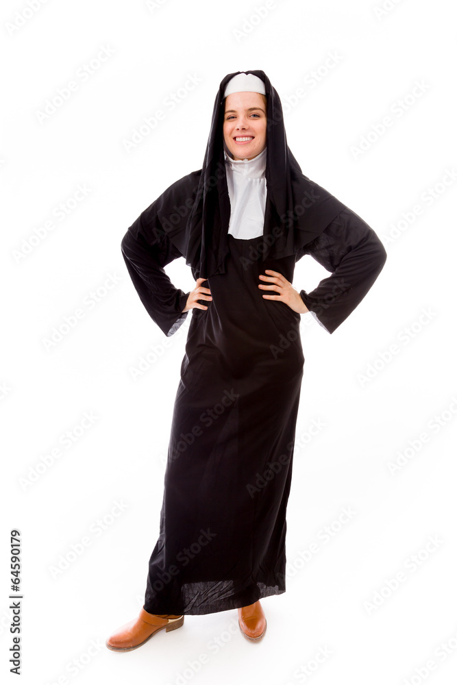 Young nun smiling with her arms akimbo