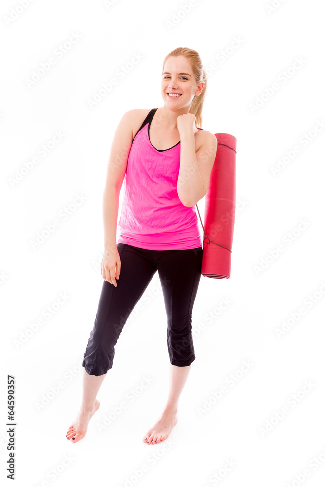 Young woman carrying exercise mat smiling Young woman carrying exercise mat smiling