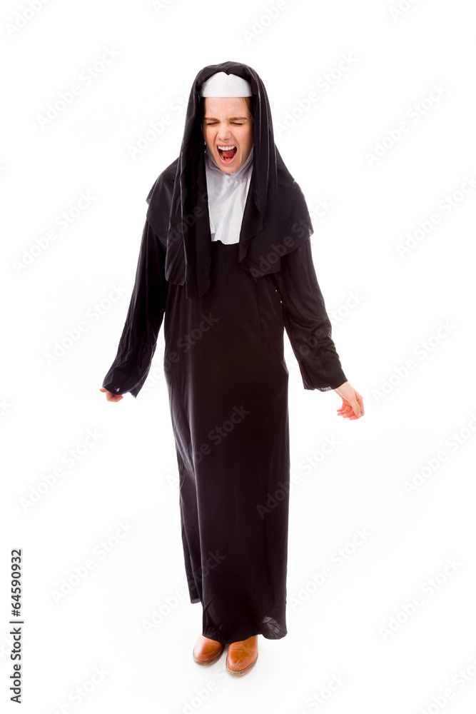 Young nun looking frustrated and shouting Young nun looking frustrated and shouting
