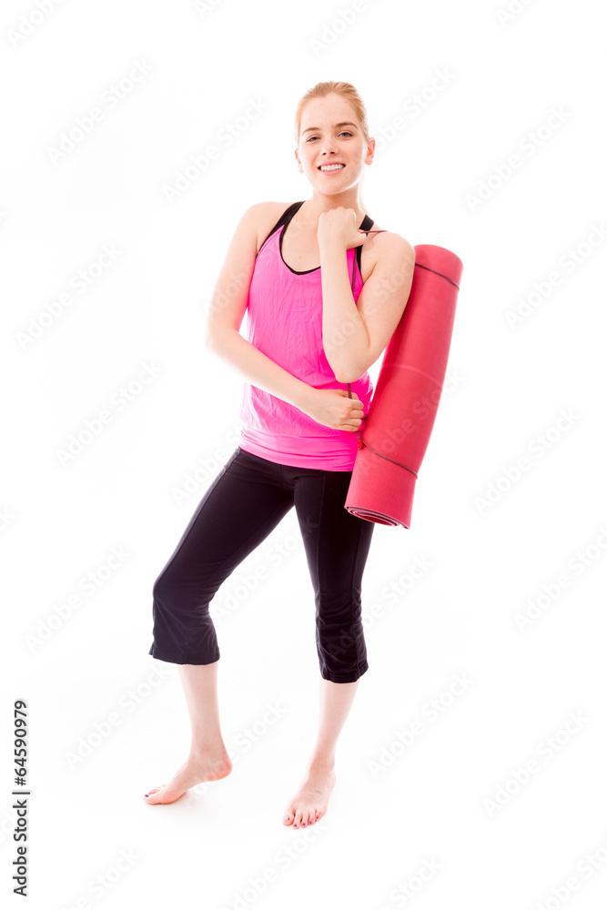 Young woman carrying exercise mat smiling Young woman carrying exercise mat smiling