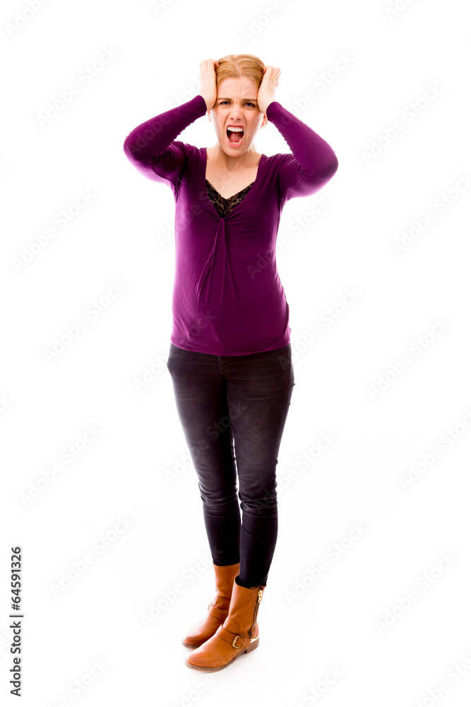 Young woman looking frustrated and pulling her hair Young woman looking frustrated and pulling her hair