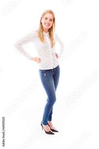 Young woman smiling with her arms akimbo