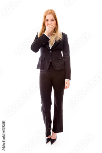 Businesswoman with hand over her mouth