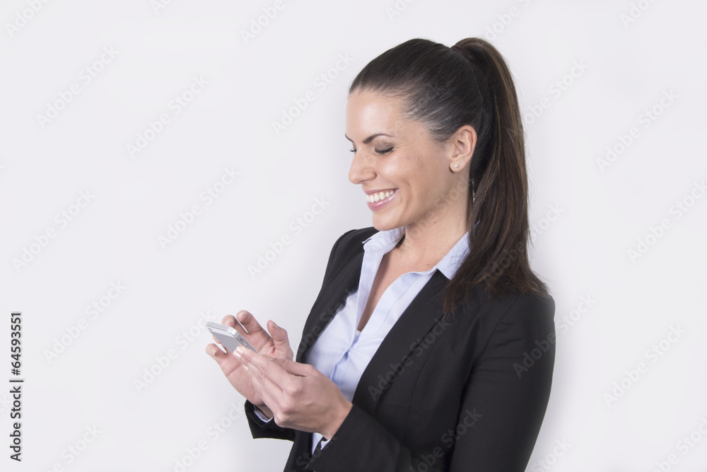 Beautiful business woman using her smartphone (telephone) Beautiful business woman using her smartphone (telephone)