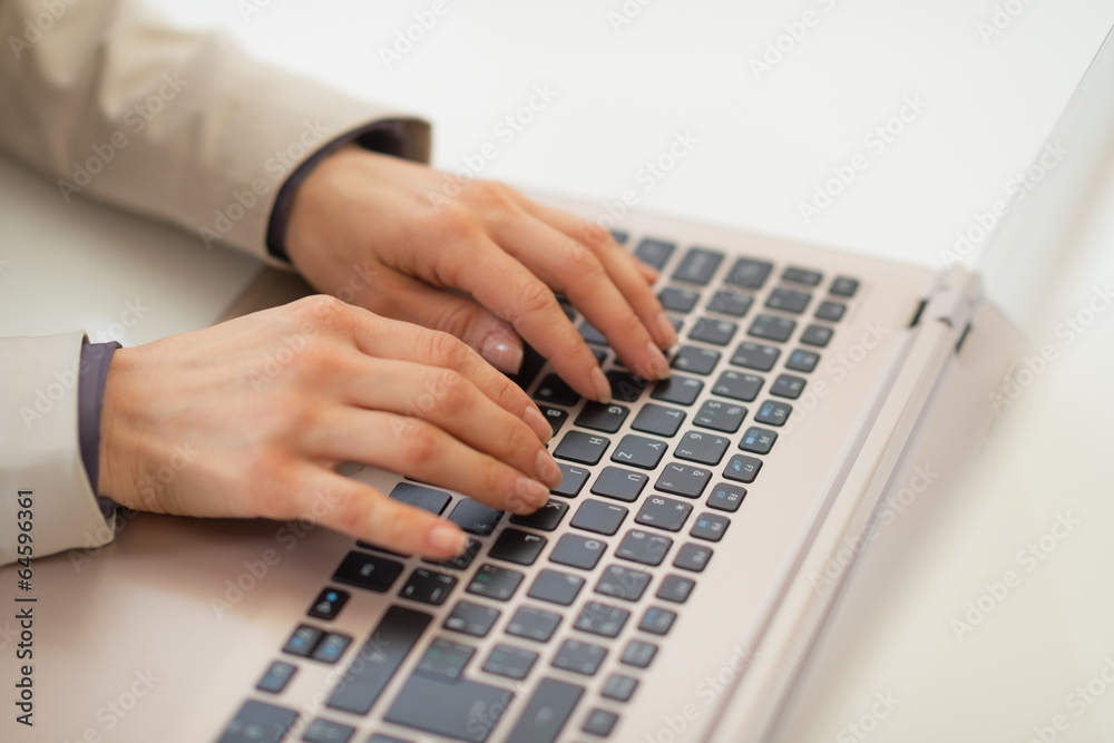 Closeup on business woman working on laptop Closeup on business woman working on laptop