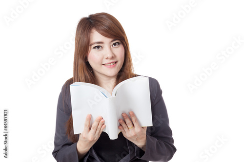 Asian businesswoman is reading a book and smile