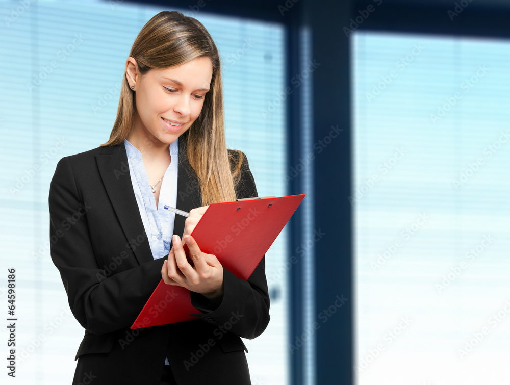 Young businesswoman writing notes Young businesswoman writing notes
