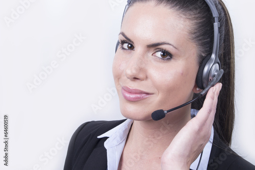 Sexy business woman with headset - working - portrait