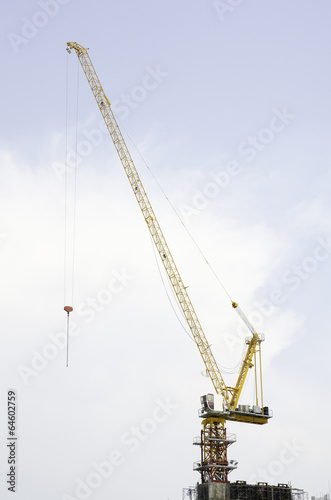 Wallpaper Mural yellow hoisting crane on blue sky background Torontodigital.ca