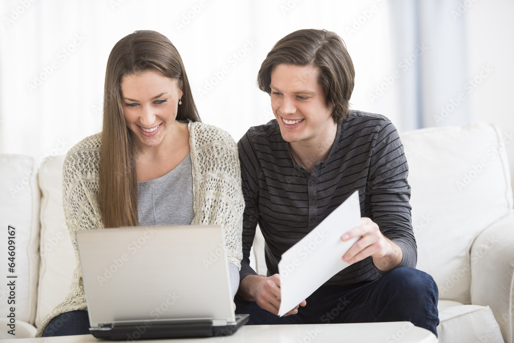 Couple Calculating Finance At Home Couple Calculating Finance At Home