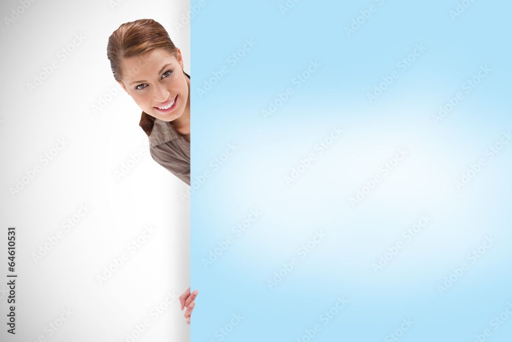 Composite image of attractive woman showing card Composite image of attractive woman showing card