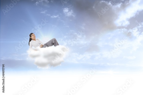 Wallpaper Mural Composite image of relaxed businesswoman lying Torontodigital.ca