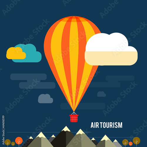 Hot air balloon flying over the mountain