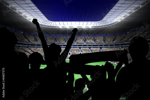 Silhouettes of football supporters