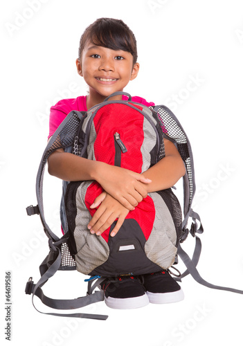 Young Malay Asian girl student with a backpack over white 