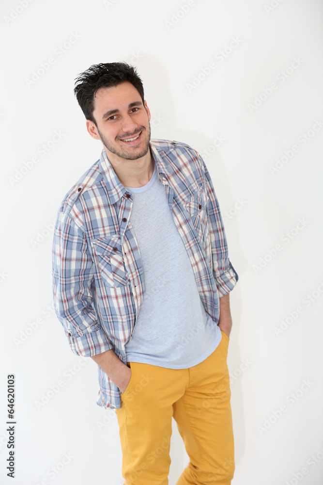 Trendy guy standing on white background Trendy guy standing on white background