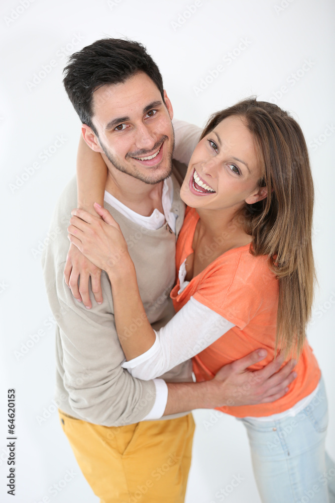 Cheerful lovely couple smiling at camera Cheerful lovely couple smiling at camera