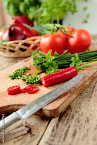 Fresh vegetables cutting on kitchen board