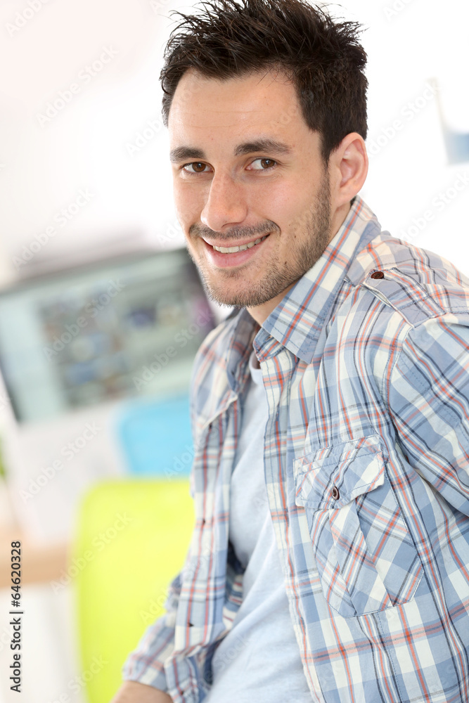Smiling young adult in office Smiling young adult in office